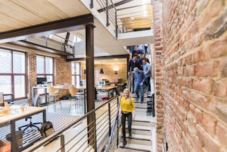 Young professional walking through a bright modern office workspace