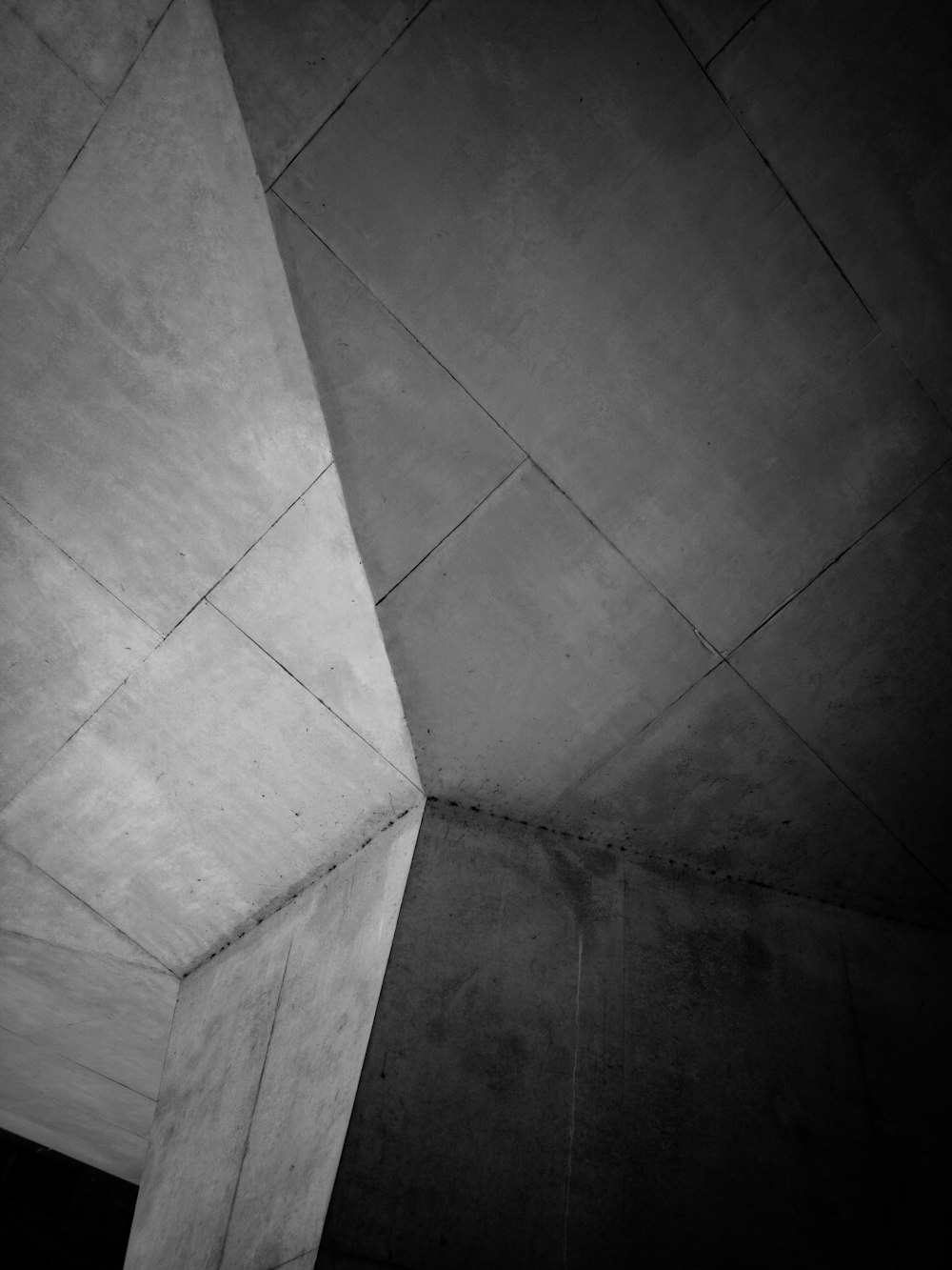 grayscale photo of gray concrete column