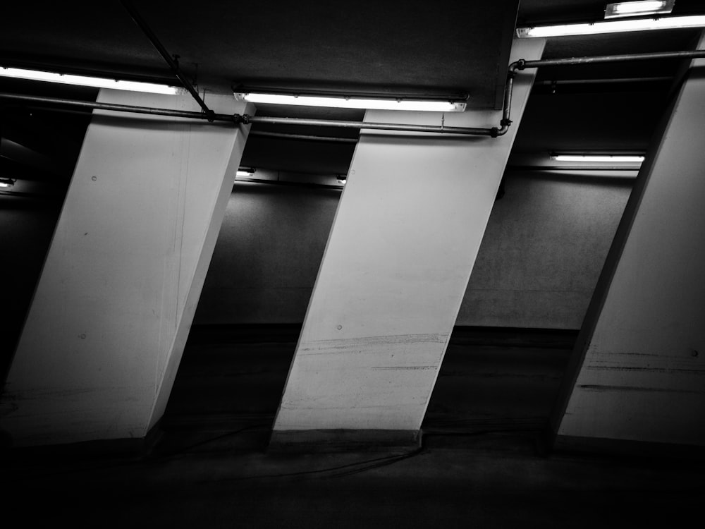 a black and white photo of a parking garage