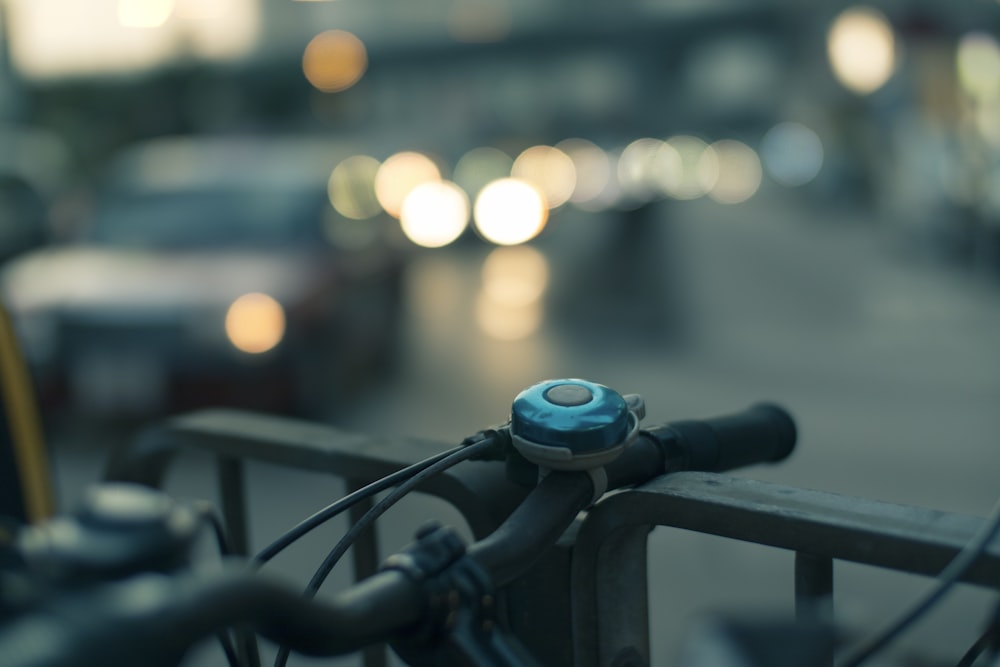 closeup photo of bicycle bell in bokeh photography