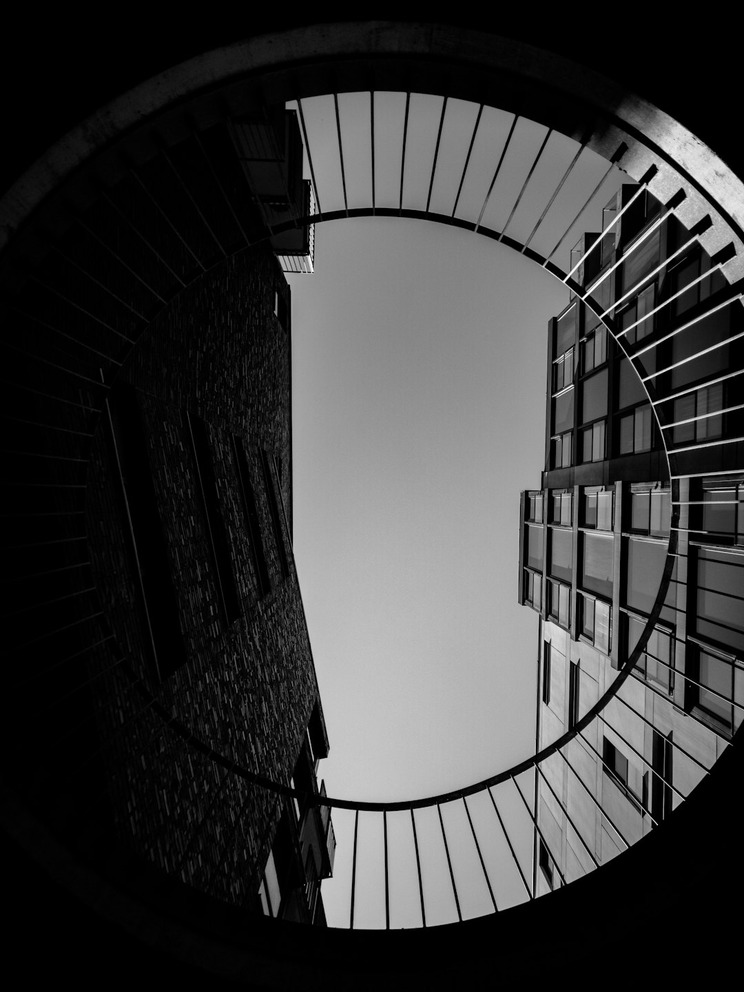 grayscale photography of building low-angle photography
