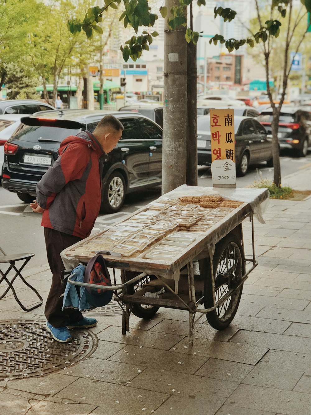 man standing in front of brown cart