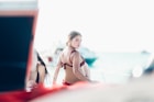 woman wearing red bikini looking over her right shoulder