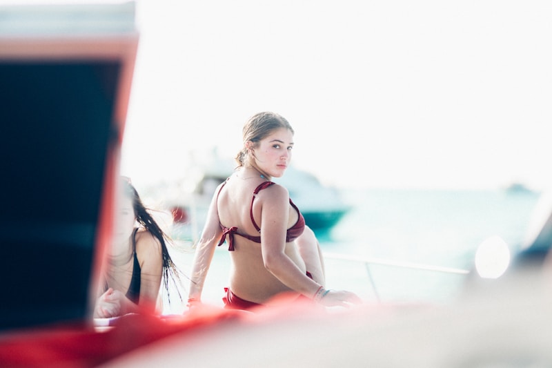 Stylish woman in red bikini at sea