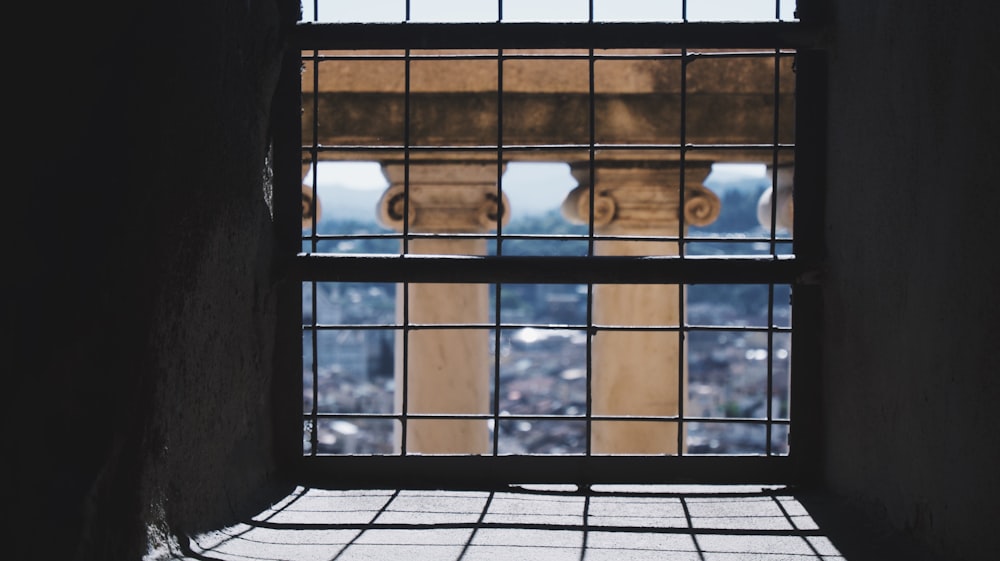 a window in a building with a view of a city