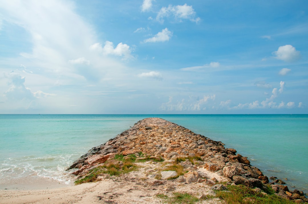 rock breakwater on beach,