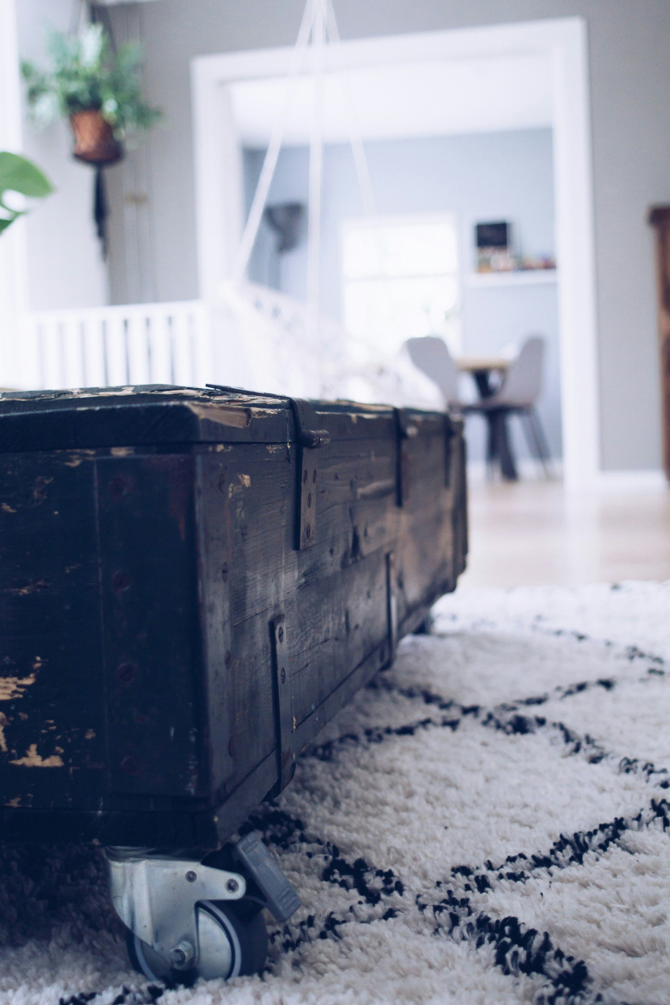 black wooden rolling chest