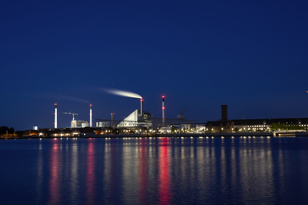 buildings near body of water during nighttime