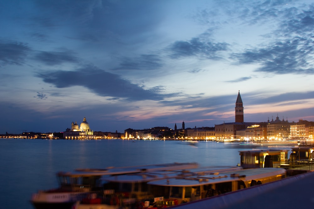 panoramic photography of city beside body of water during nighttime