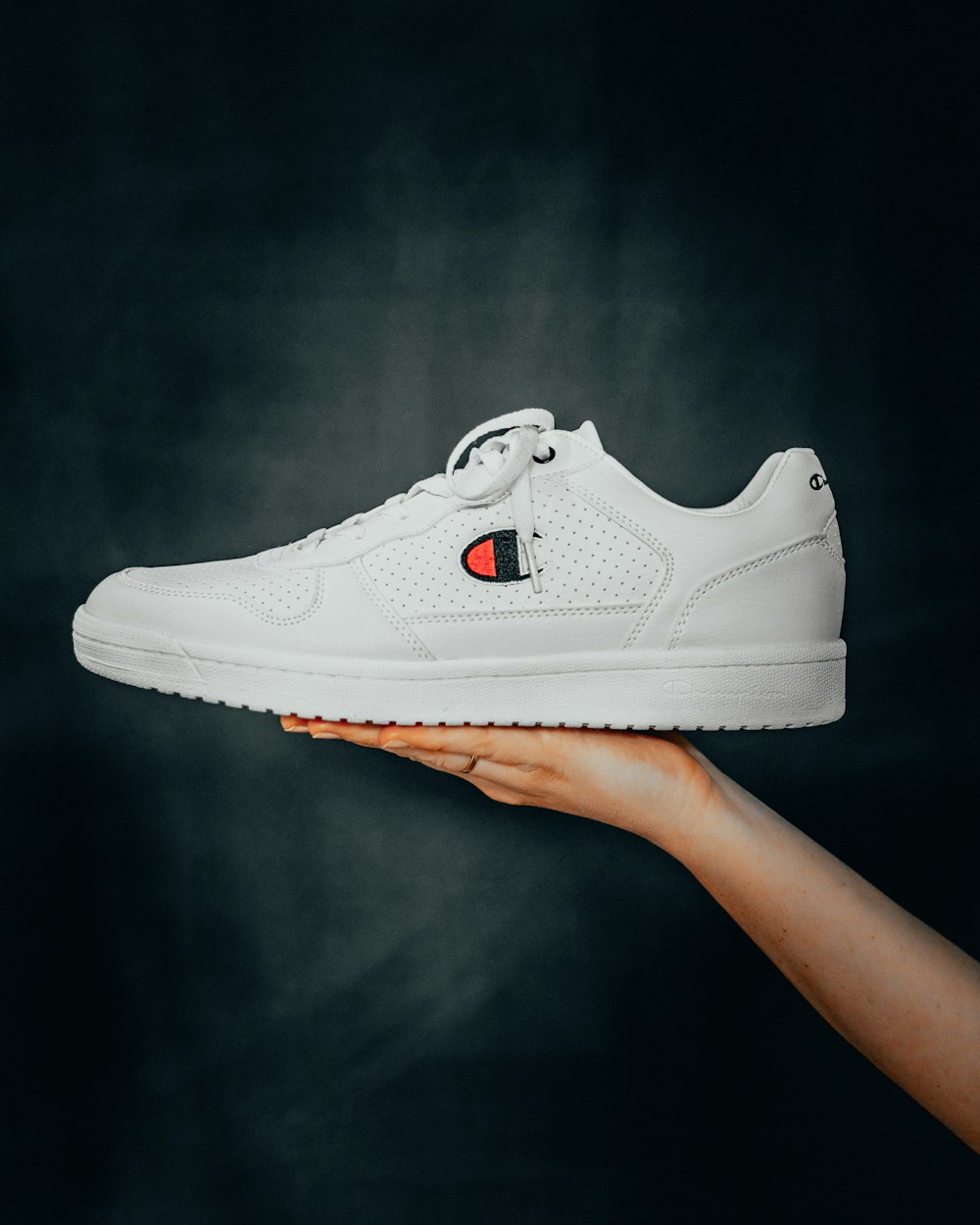 Unpaired white Champion low-top sneaker photo – Free Sneaker Image on  Unsplash