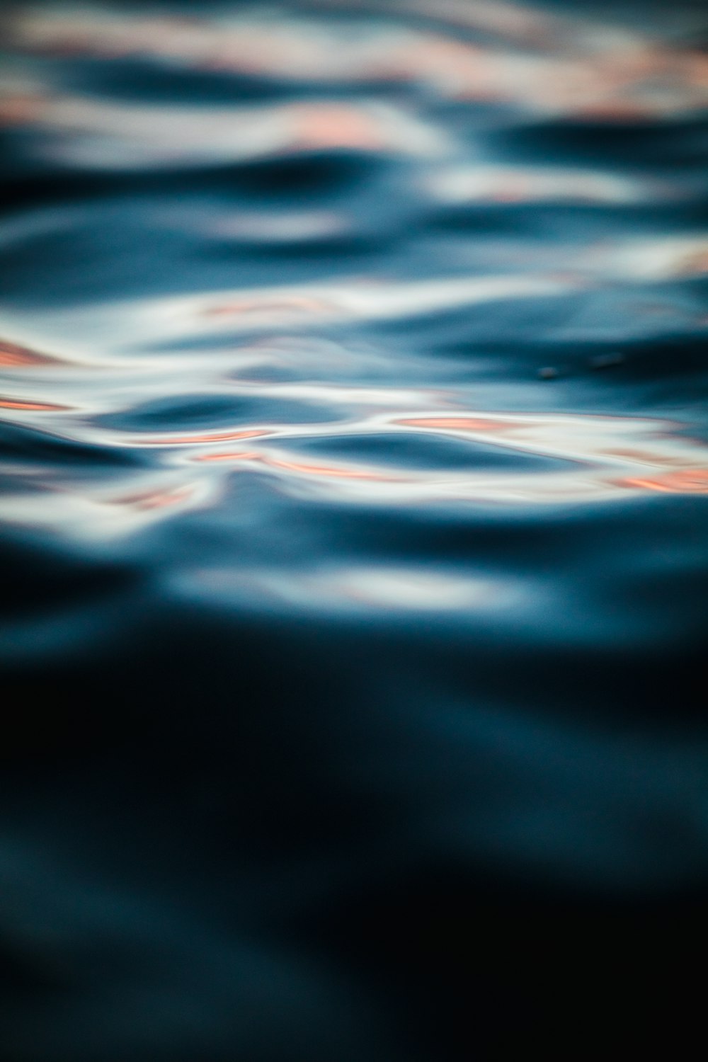 time lapse photography of rippling blue water