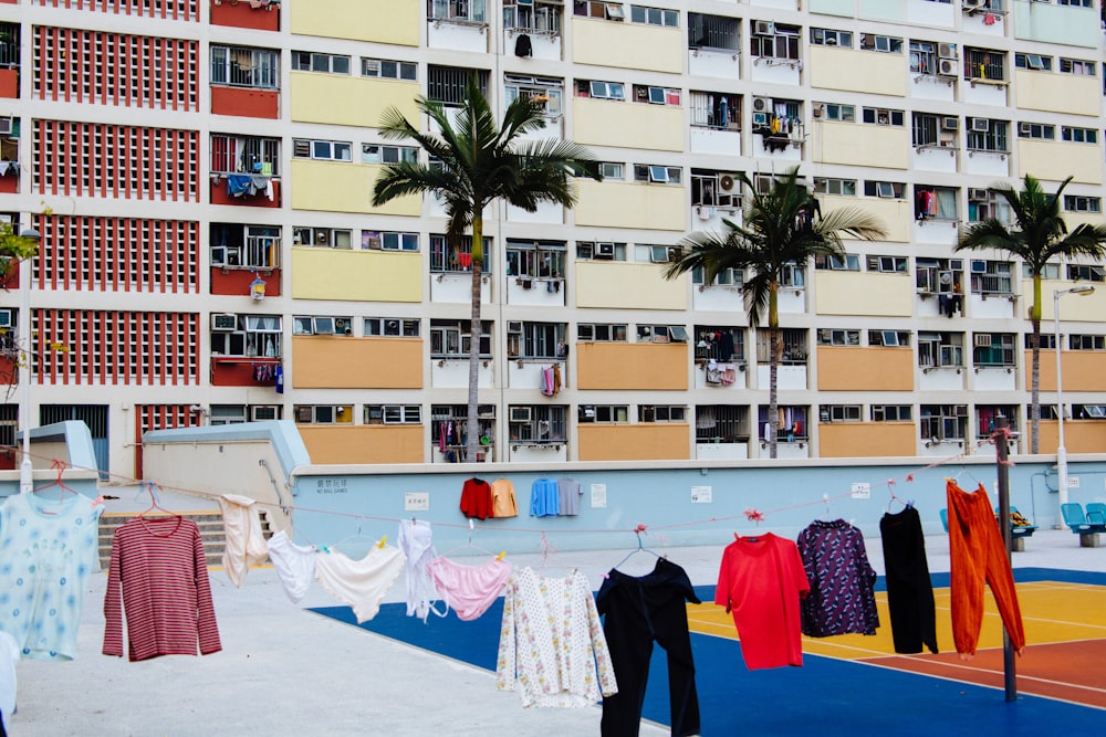 assorted-color clothes hanged near building