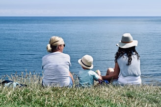 women and child near ocean