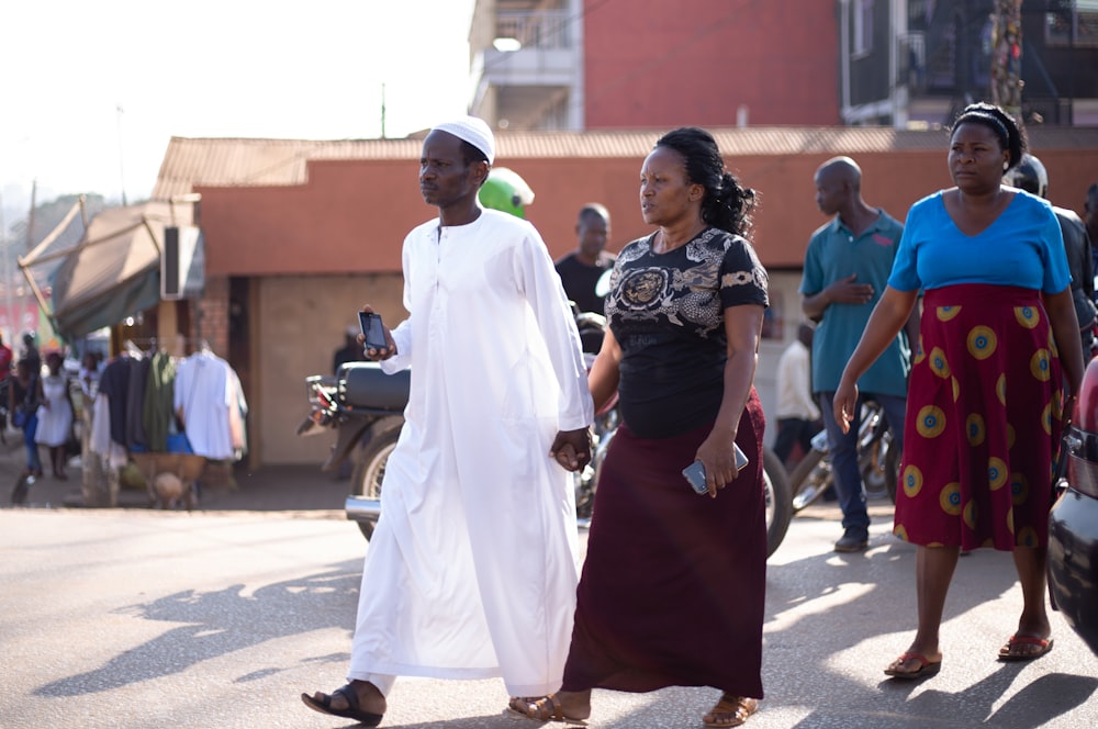 man wearing kurta walking with woman wearing t-shirt