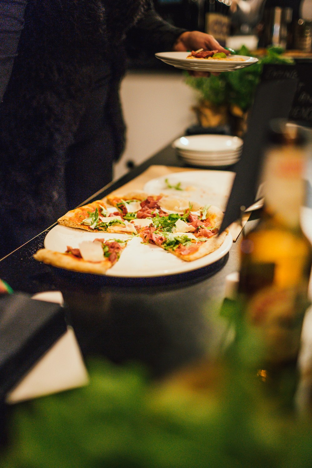 vegetable pizza in round white ceramic plate