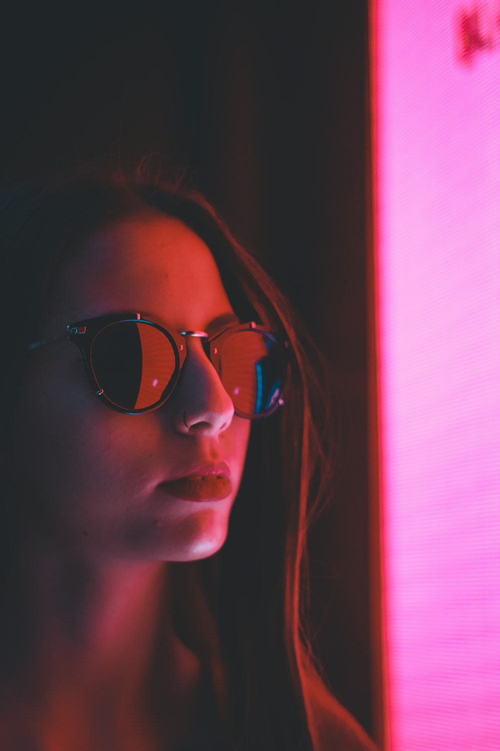 woman with sunglasses in room