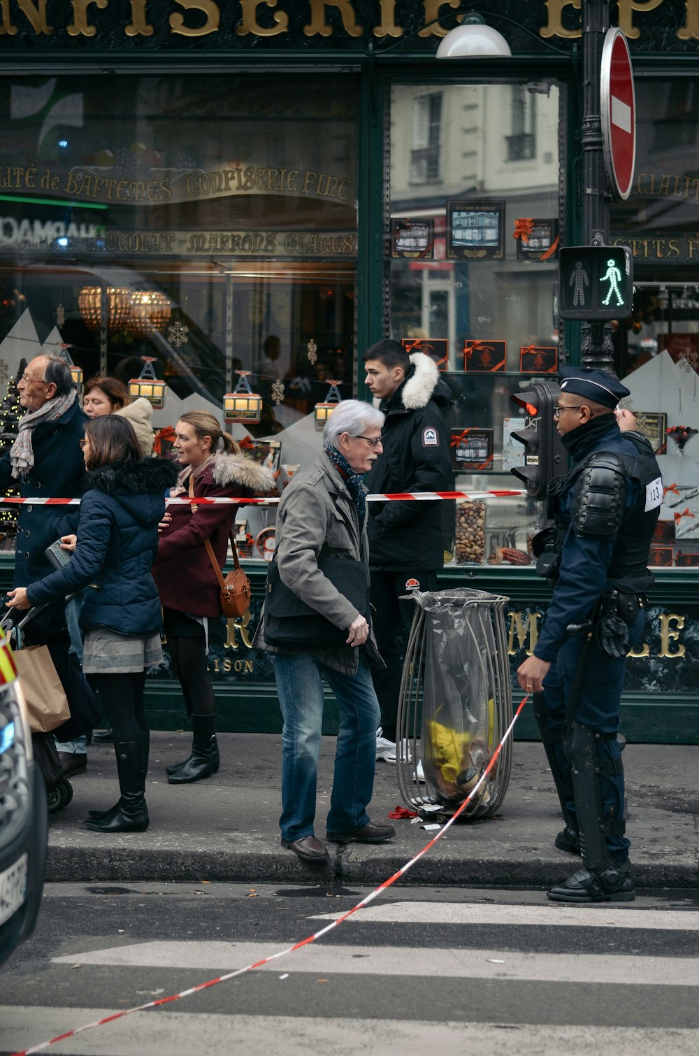 people standing at the side of the street