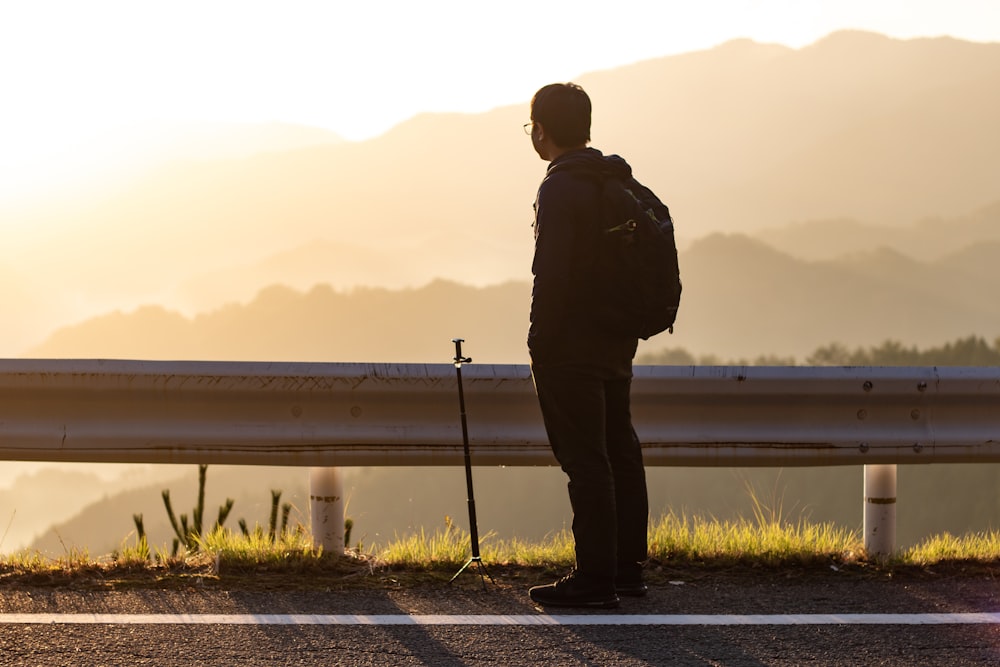 man overlooking mountains during golden hour