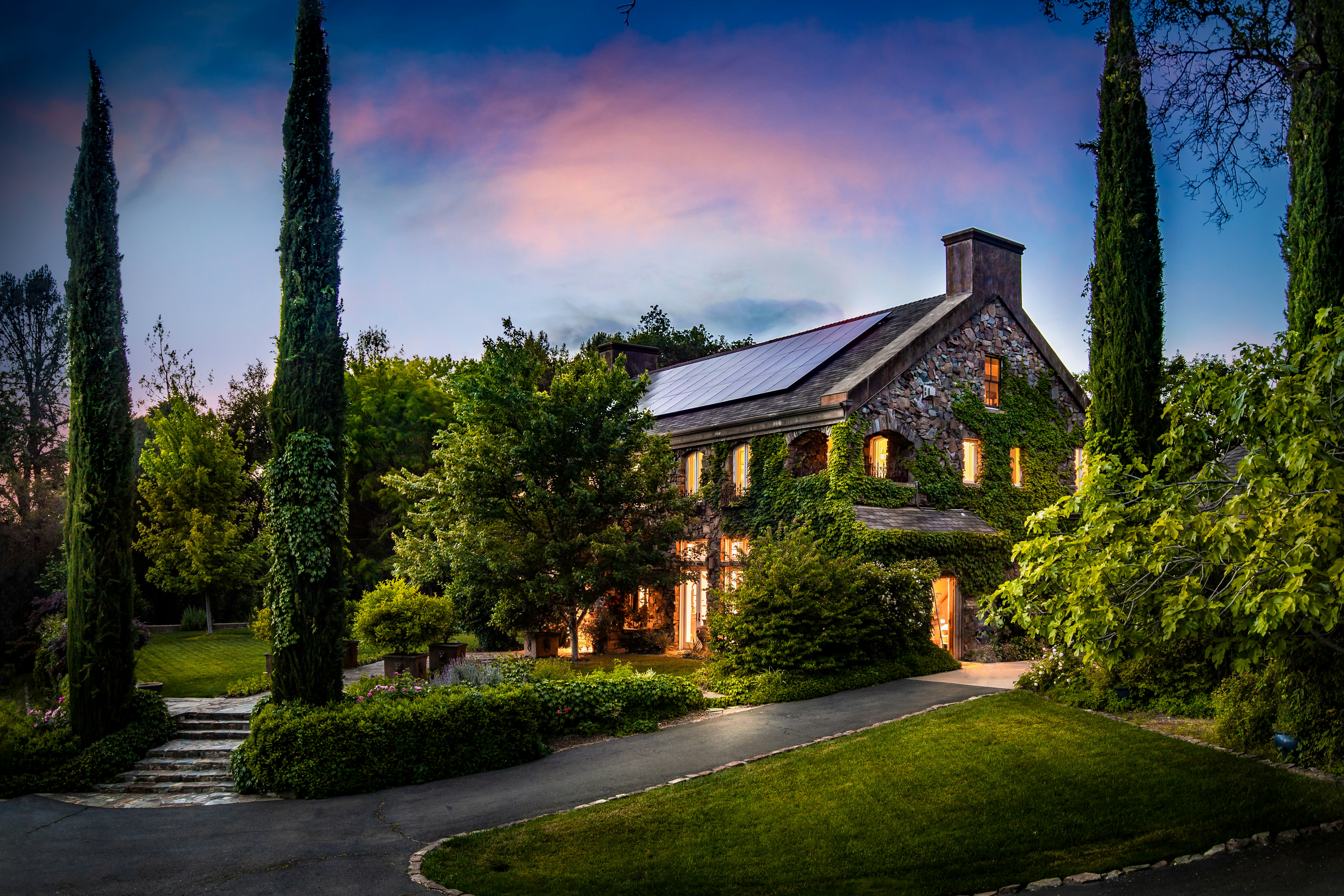 gray and white house surrounded by trees