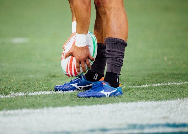 man holding rugby ball