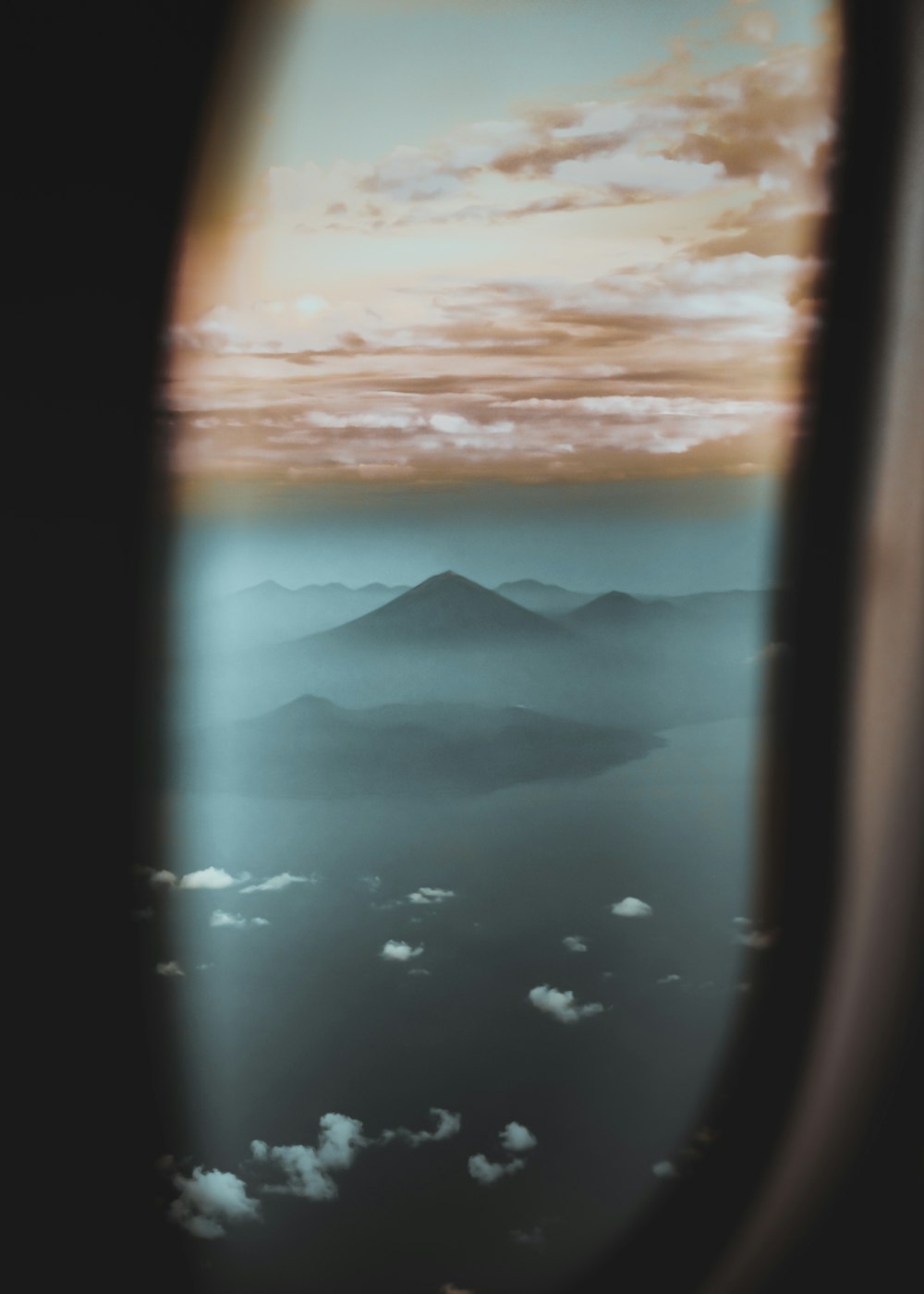 airplane window view of mountains