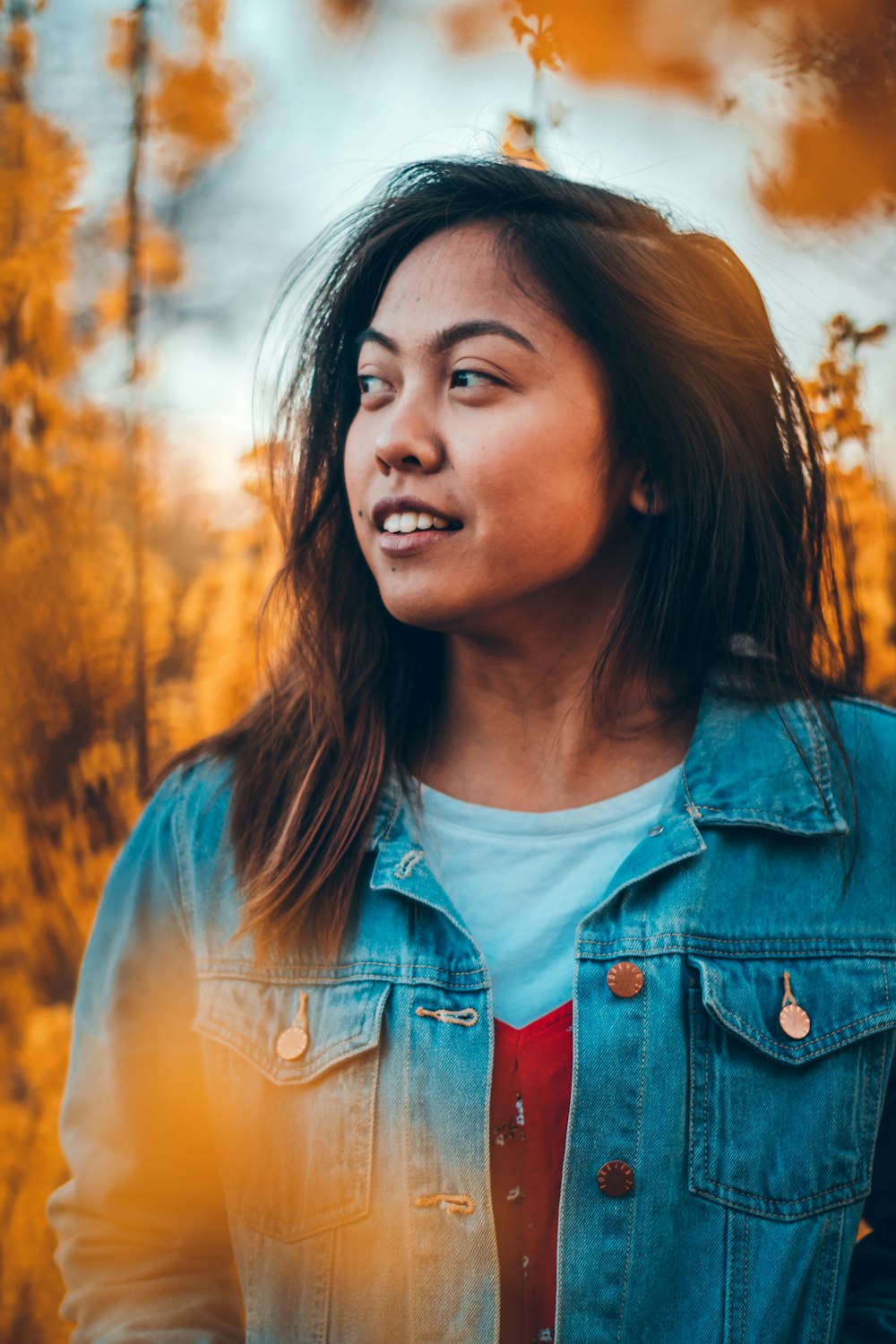 woman wearing blue denim jacket