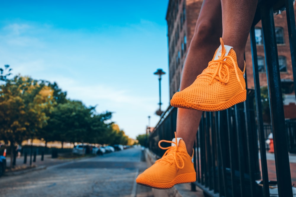 person wearing orange shoes