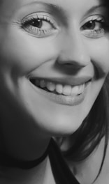 A portrait of a smiling person, showcasing realistic details and emotions.