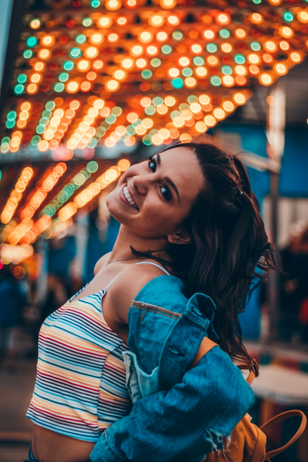 woman under string lights