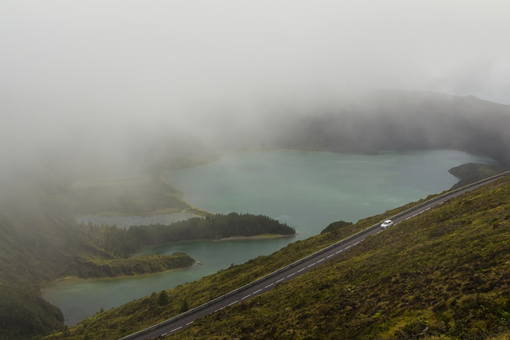 high-angle photography of road near lake