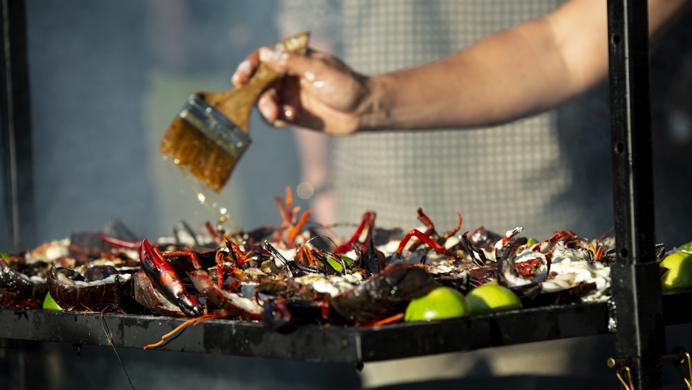 person grilling food