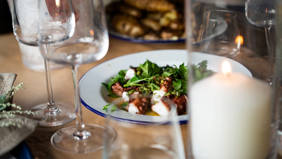 cooked food on plate on wooden table,
