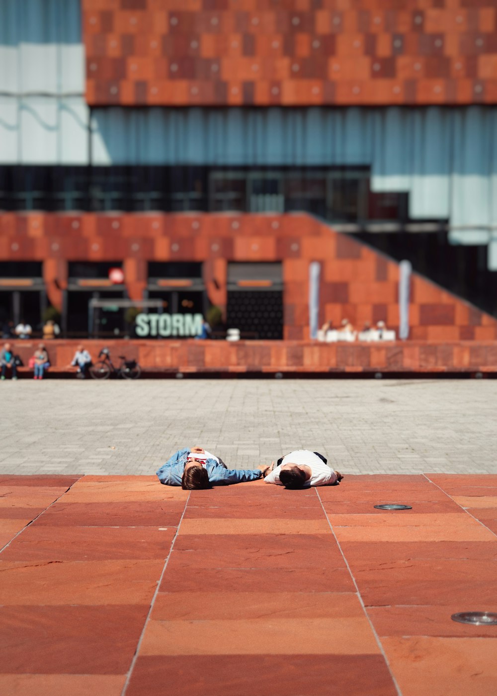 two persons lying on ground