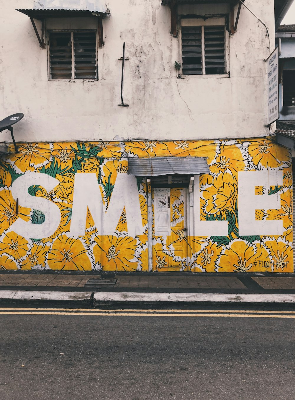 yellow and white smile wall art