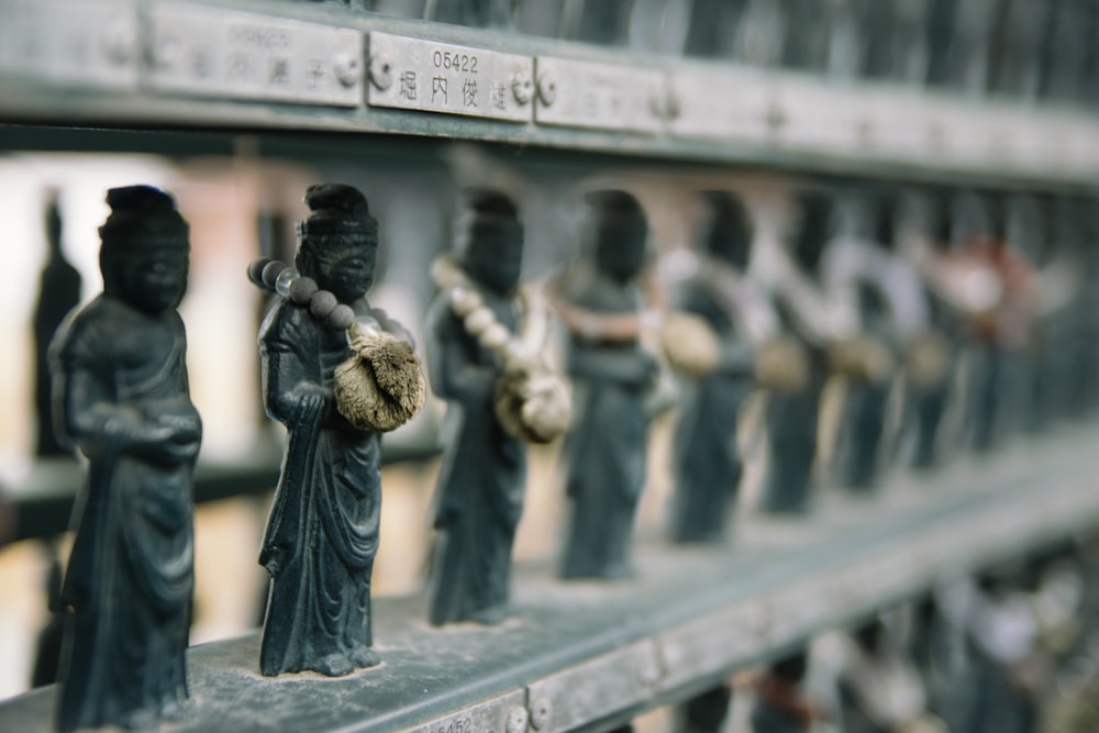 selective focus photography of figurine