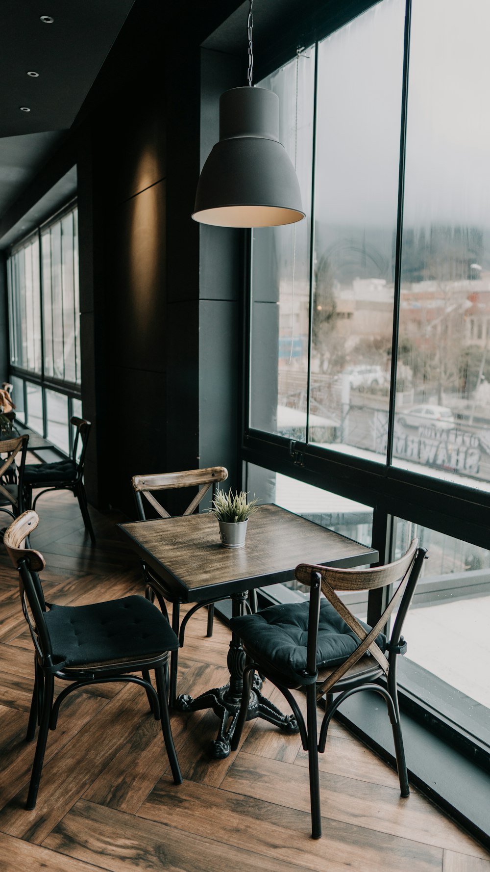 vacant table and chair in room during daytime