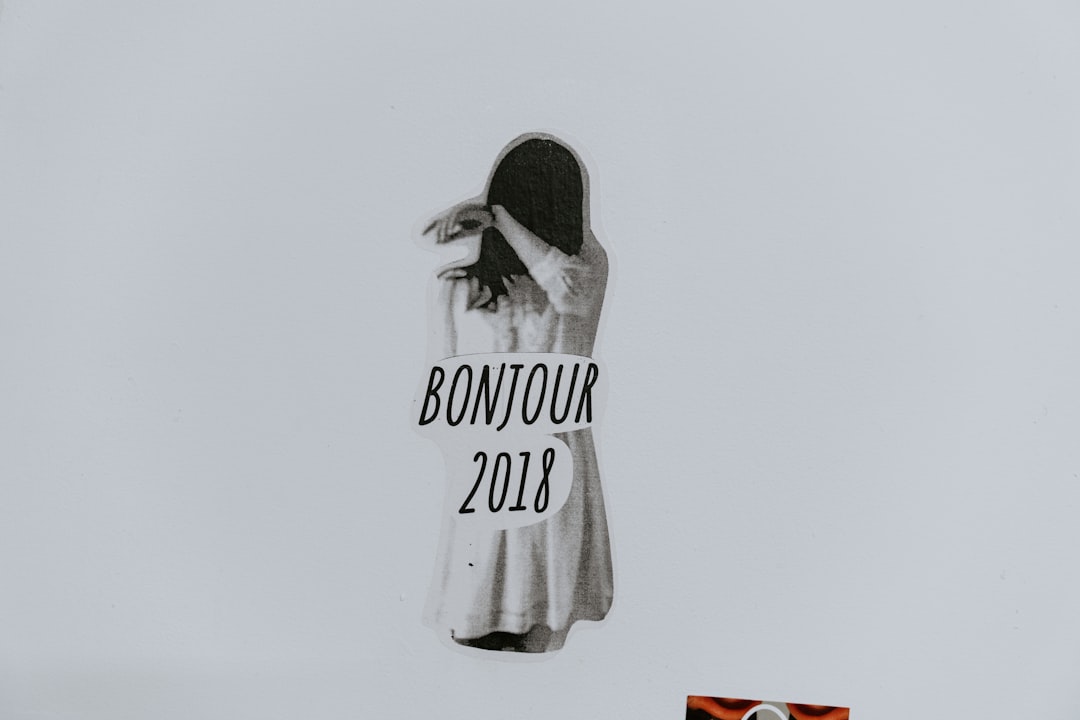 woman in gray dress with bonjour 2018 text illustration