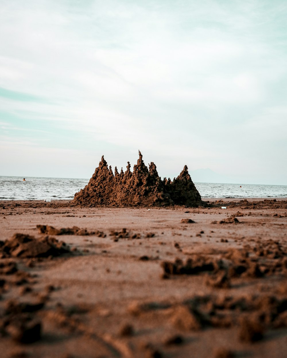 sand castle on seashore during daytime