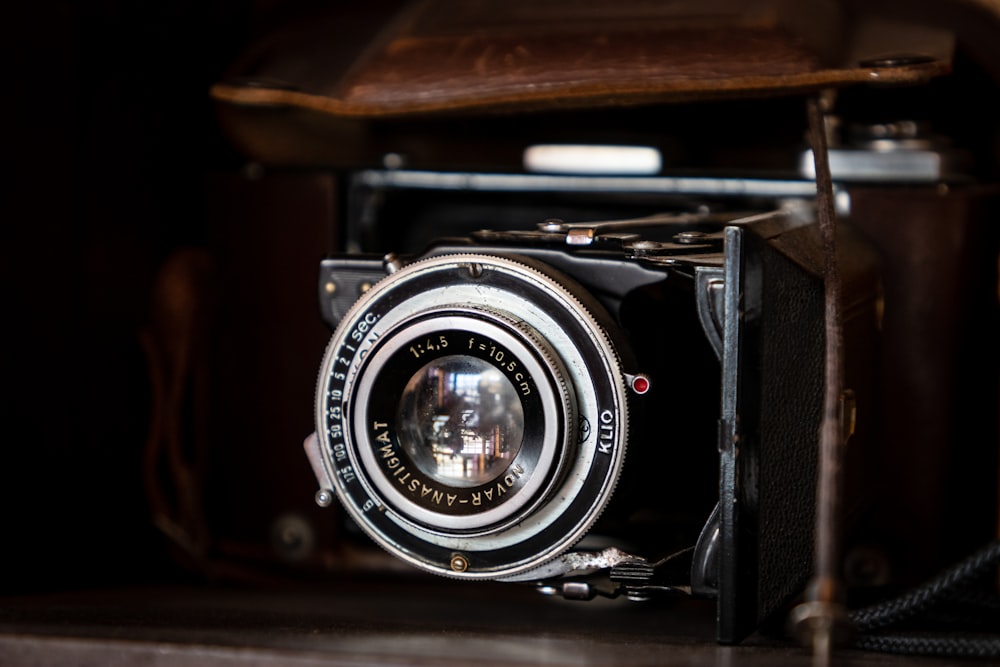 black and brown folding camera