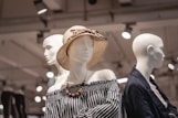 shallow focus photo of mannequin wearing brown sunhat