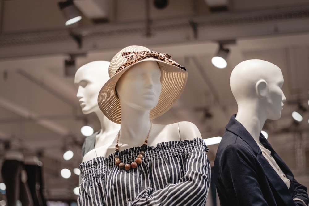 shallow focus photo of mannequin wearing brown sunhat