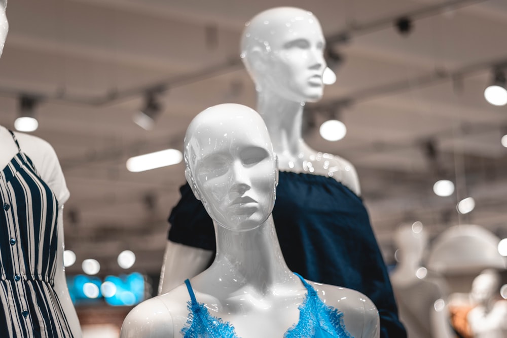 a group of mannequins in a clothing store