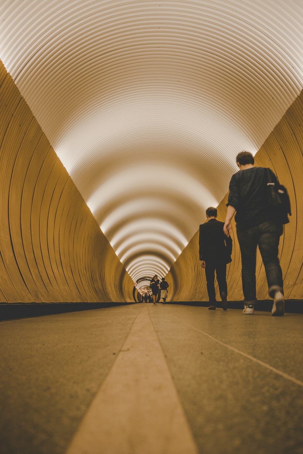 people walking on tunnel