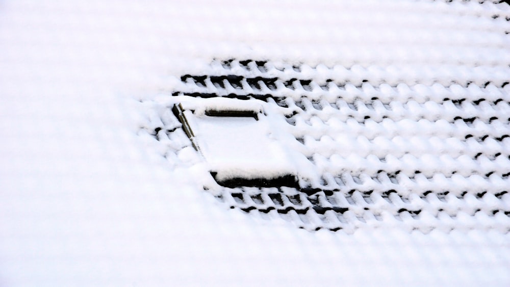 a close up of a cell phone in the snow
