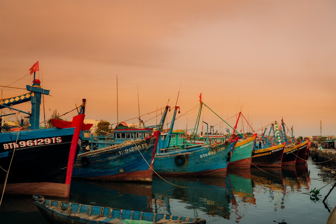 assorted-color boat in body of water during daytime