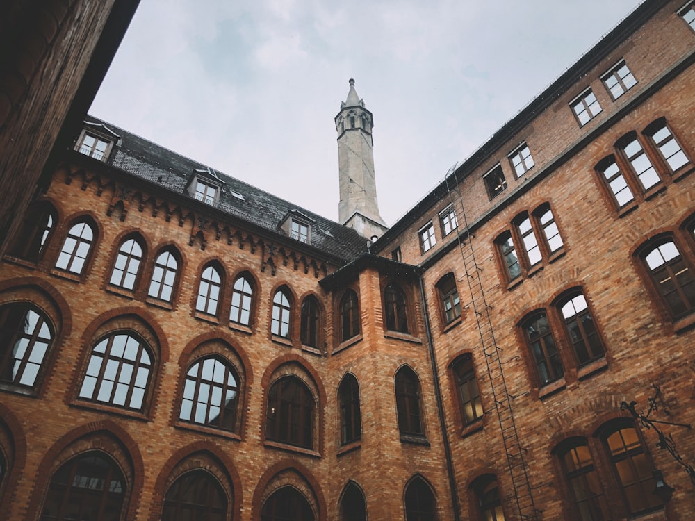 low-angle photography of brown building