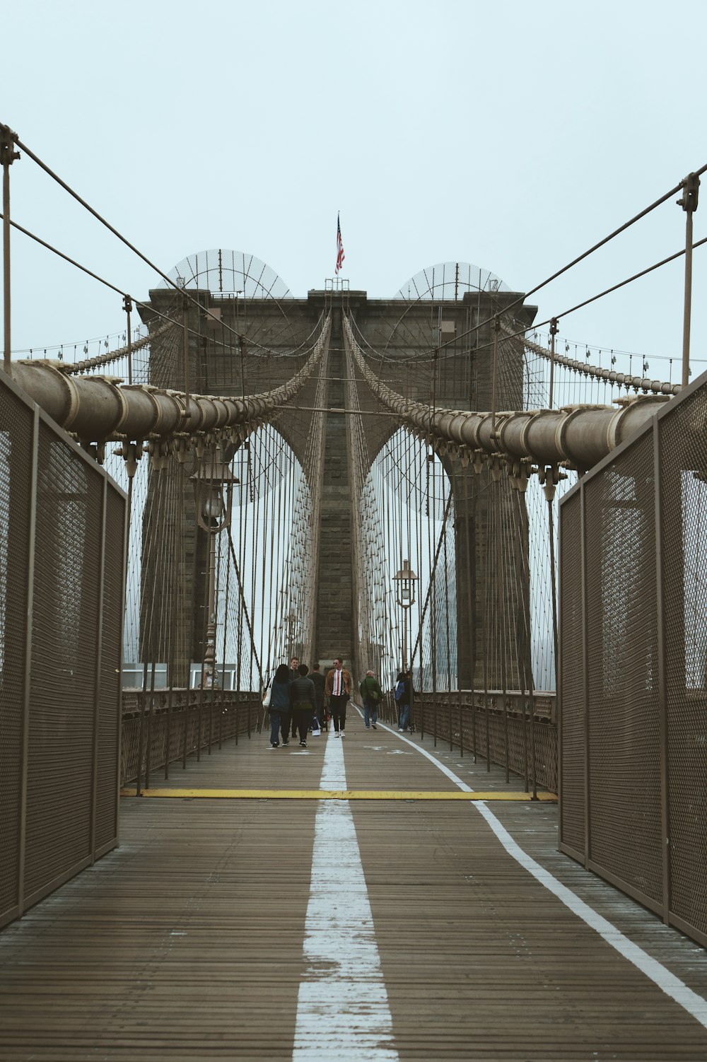 people walking on bridge during daytime