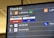 The image displays an airport check-in board featuring several airline logos and their respective check-in details. The board is predominantly black with white text and colored airline logos, showing Lufthansa prominently along with other associated airlines like SWISS, SAS, and Air Malta.