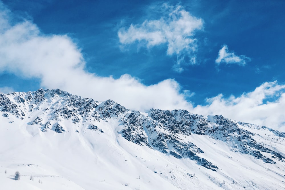 snow covered mountain during daytime