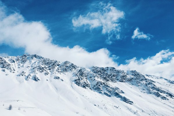 Snow covered mountain during daytime — Livigno, Italy